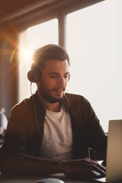 istock Casual Man Working with Headphone 1040390542