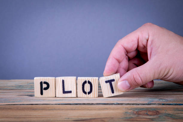 istock plot. Wooden letters on the office desk 1040393880