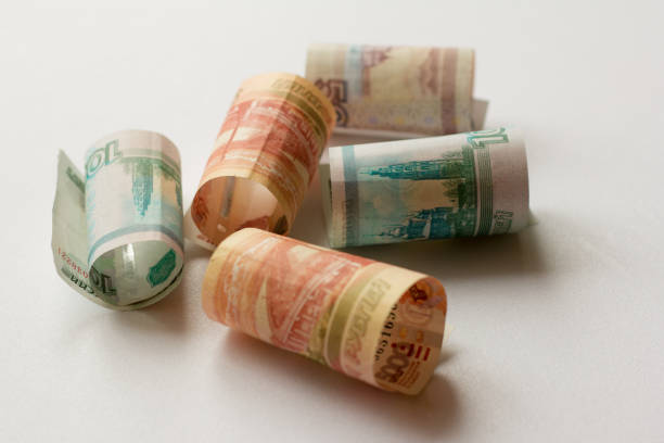 istock Russian money, banknotes of five thousand, one thousand and five hundred rubles rolled into a tube 1040394992