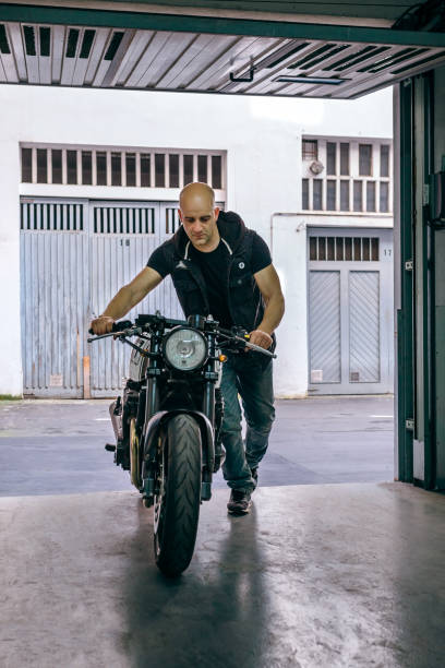 istock Biker taking motorbike to the garage 1040395418
