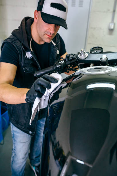 istock Mechanic cleaning a motorcycle 1040395464