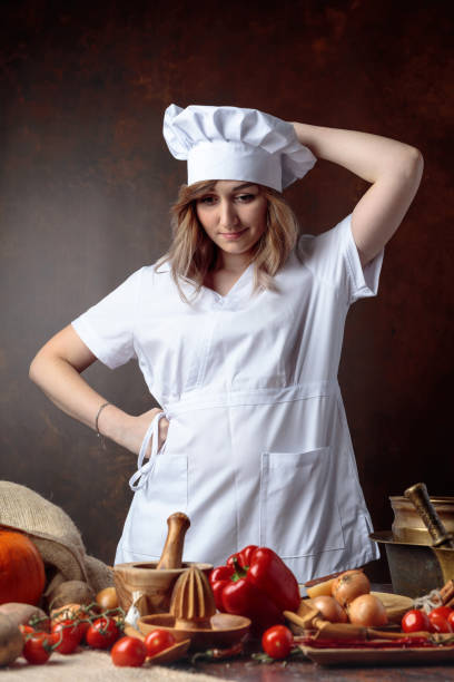 istock Young beautiful girl in a chef uniform . 1040400456