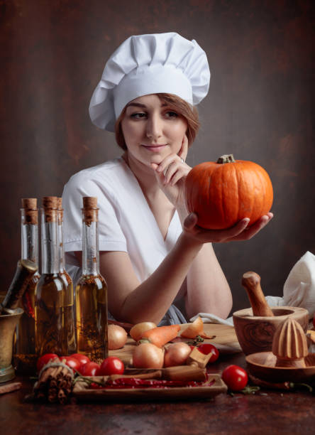 istock Young beautiful girl with pumpkin. 1040400606