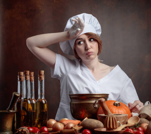 istock Tired young beautiful girl in a chef uniform. 1040400658