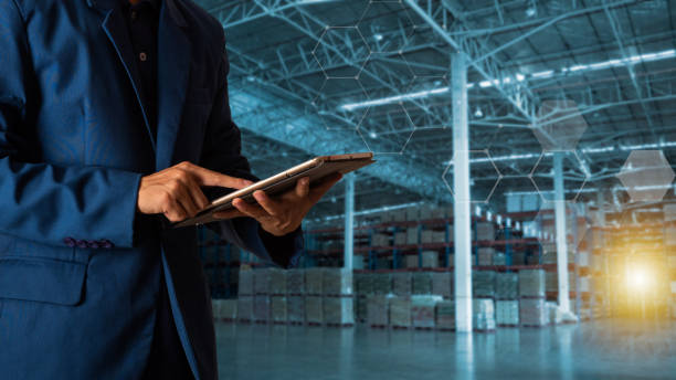 istock Businessman manager using tablet check and control for workers with Modern Trade warehouse logistics. Industry 4.0 concept,planning of logistics, Transportation within the country and Global. 1040404348