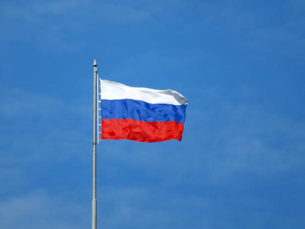 istock Waving Russian flag isolated on blue sky background 1040410470