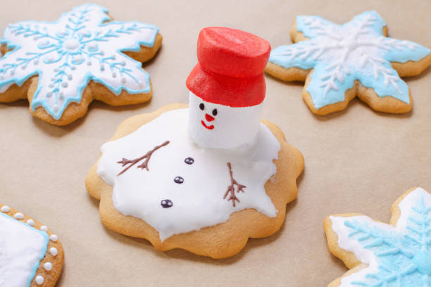 homemade gingerbread like melting snowman on the baking paper, closeup