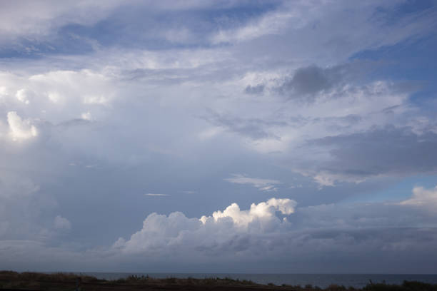 istock Cumulus clouds and sun in the sky 1040414936