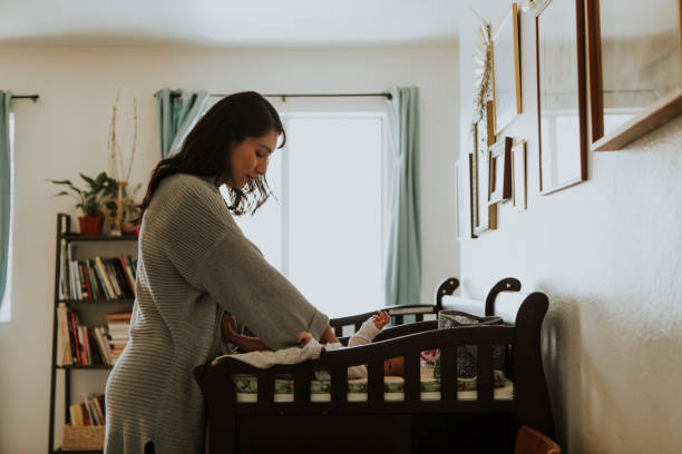 istock Mother changing a diaper on a newborn baby 1040421902