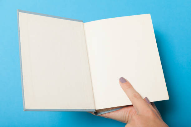 istock Hardcover book mockup, brochure in hands 1040422886