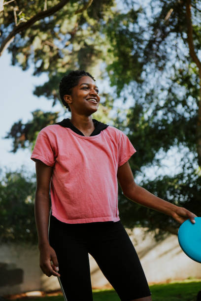 istock Active woman throwing a frisbee in the park 1040422918