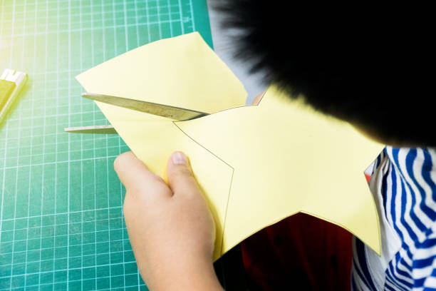 istock The boys are cutting the paper in a star pattern 1040432936