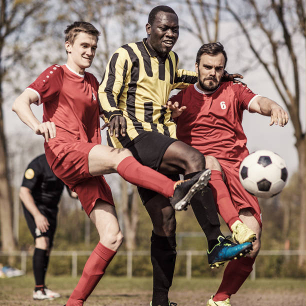istock Players competing for the football 1040444810