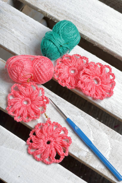 istock Earrings knitted by an entrepreneur. 1040454036
