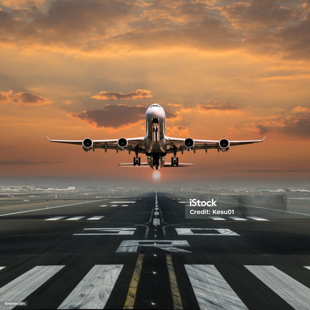 Jet plane taking off the airport. Jet plane taking off the airport, front view. Aerospace Industry Stock Photo