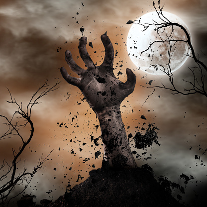 Scary Halloween background with zombie hands. Horror theme.