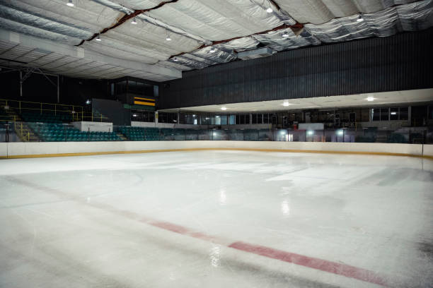 Empty Ice Rink Wide angle view of an interior of an empty ice rink. There are no people in the seats or on the ice. ice rink stock pictures, royalty-free photos & images