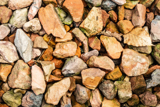 istock Scattered multi-colored stones for modern background texture and graphic use. 1040458874