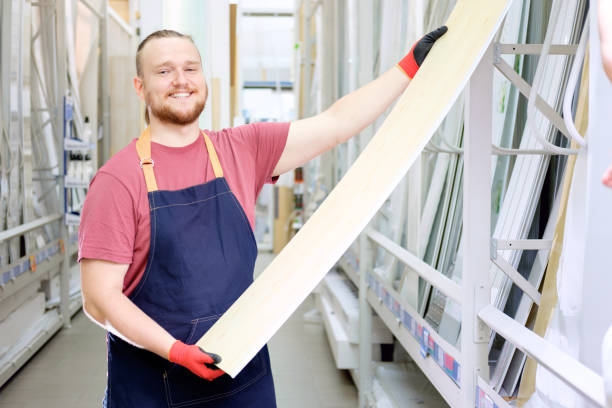 istock Smiling bearded white salesman in construction superstore offers siding 1040458992