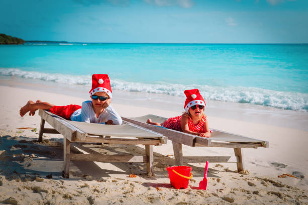 istock kids celebrating christmas on tropical beach 1040459424