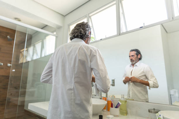 istock Mature Man in The Bathroom Getting Ready in The Morning 1040459824