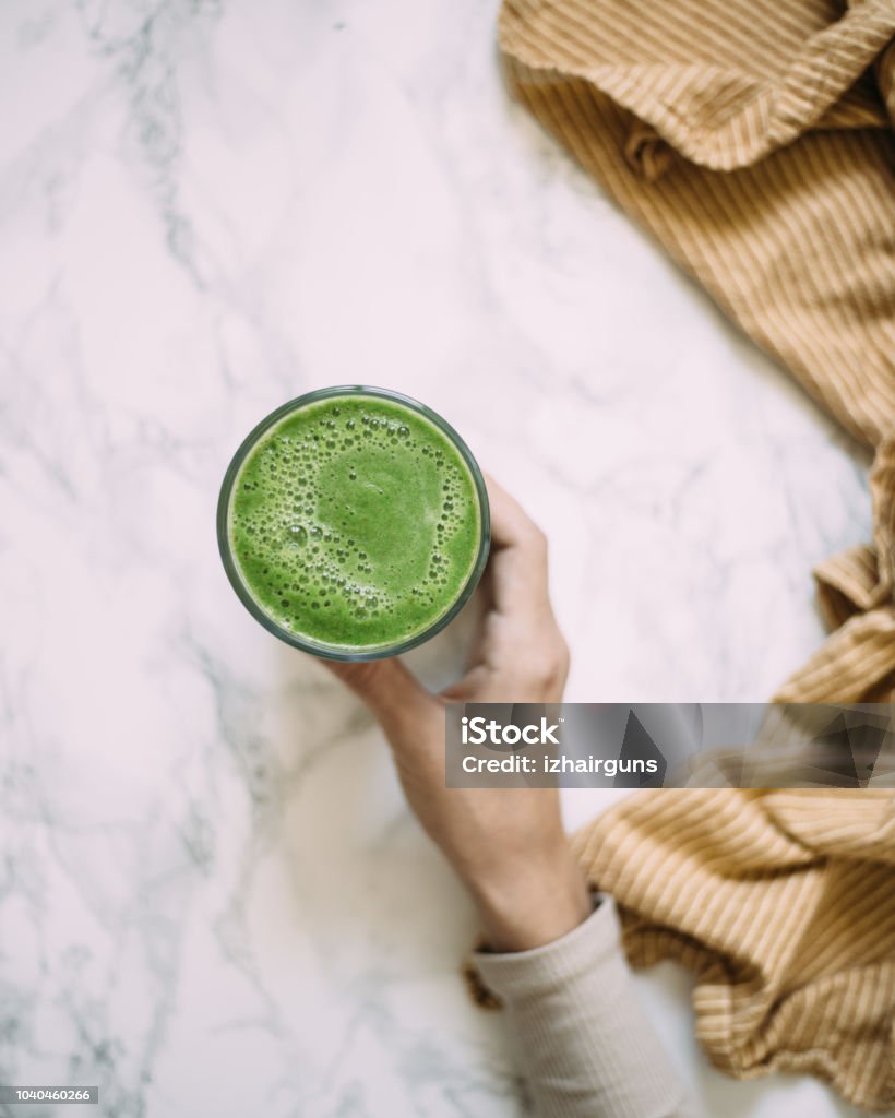 Spinach smoothie on marble background Smoothie Stock Photo