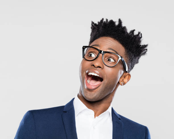 sorpreso giovane uomo d'affari afro-americano - isolated on white surprise happiness joy foto e immagini stock
