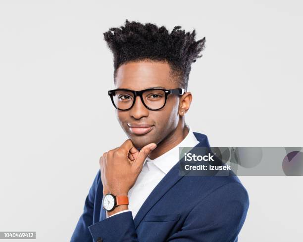 Confident Young African Businessman Stock Photo - Download Image Now - Contemplation, Eyeglasses, Men