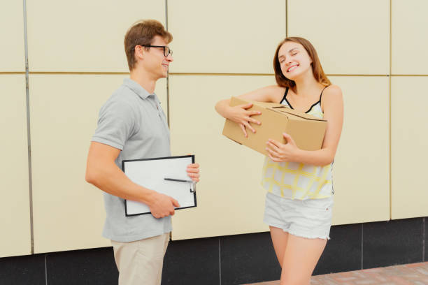 istock Handsome man delivering a parcel for joyful girl 1040472746