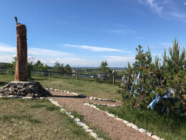 istock Ancient wooden pagan obelisk surrounded by a path 1040477474