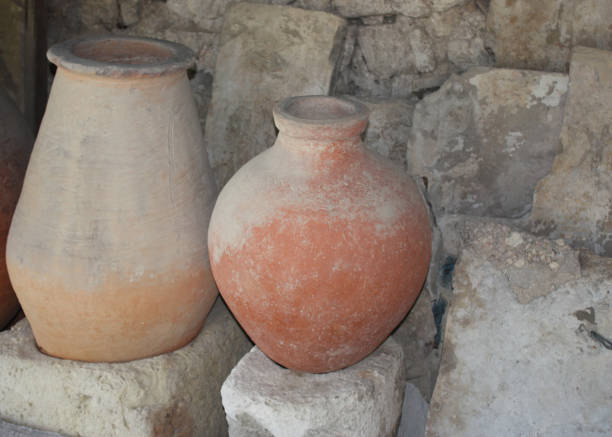 istock Clay jugs on the background of a stone wall. 1040481864
