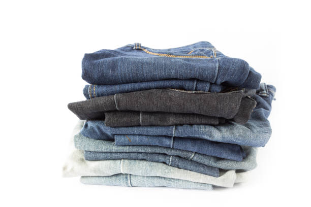 istock Blue jeans stacked  isolated on white background 1040482710
