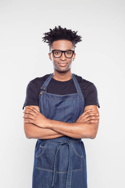 istock Afro american male shop worker wearing apron 1040486546