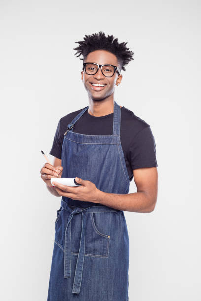 istock Happy waiter with pen and notepad 1040486806