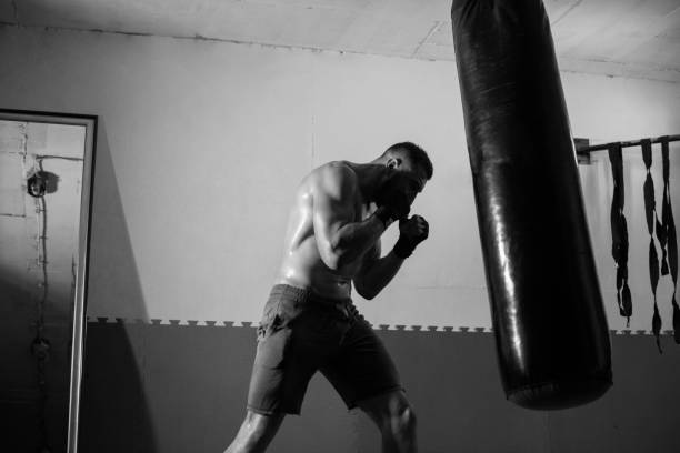 istock Young man boxing workout in an old building 1040490372