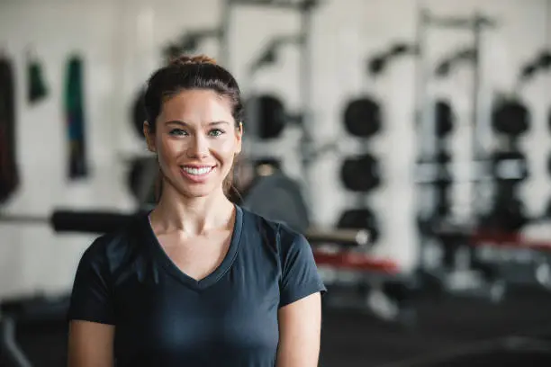Photo of Portrait of a Female Personal Trainer in the Gym