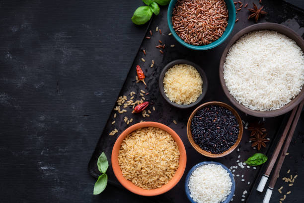 istock Variety of rice types in different bowls with copyspace 1040506192