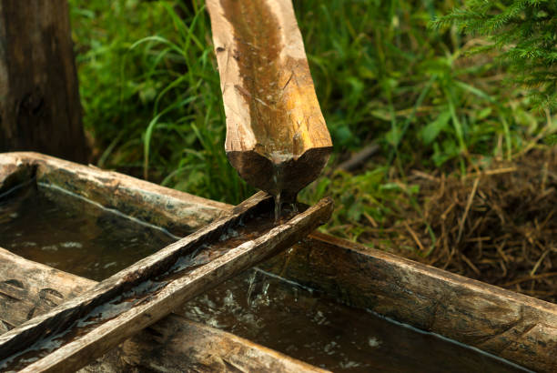 istock primitive water pipe from wooden gutters 1040506270