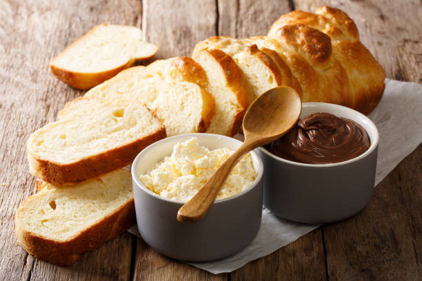 istock sliced fresh brioche bread and cream cheese, chocolate cream close-up. horizontal 1040506530