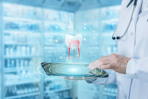 Doctor works with the tooth model in the tablet .