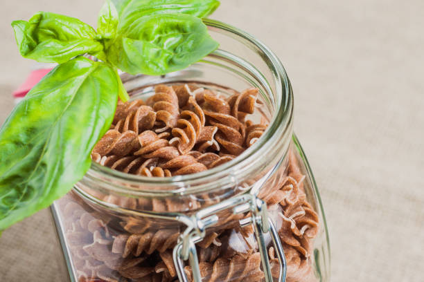 istock Open glass jar with fusilli paste close-up 1040518580