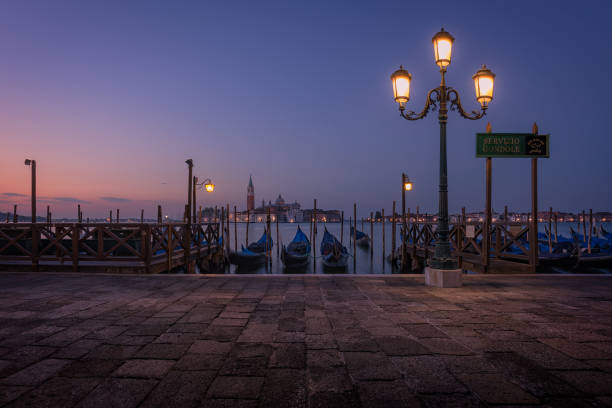 Peaceful Sunrise in Venice with Gondolas, Italy. stock photo