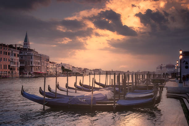 Gondolas in Grand Canal, Venice, Italy At Sunrise stock photo