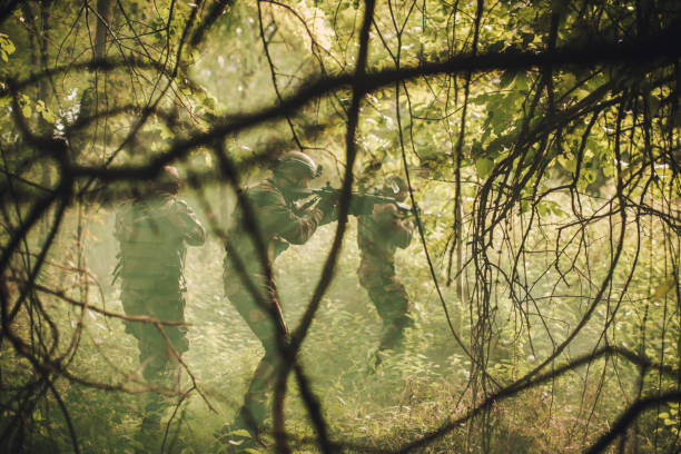 istock Military on a mission in wilderness 1040523980