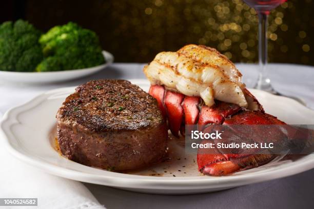Steak And Lobster On A White Plate And Table Cloth Stock Photo - Download Image Now - Steak, Lobster - Seafood, Seafood