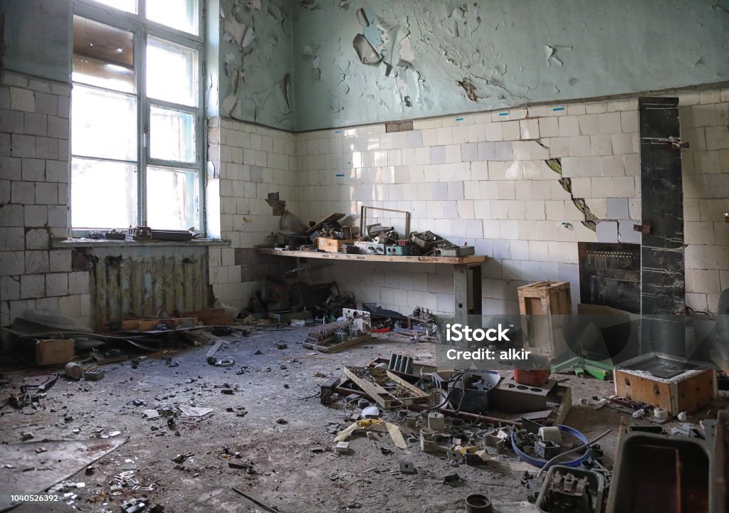 Ruins of industrial enterprise The interior of an old abandoned and crumbling building of the Soviet meteorological station in the Tian Shan mountains, Kazakhstan Abandoned Stock Photo