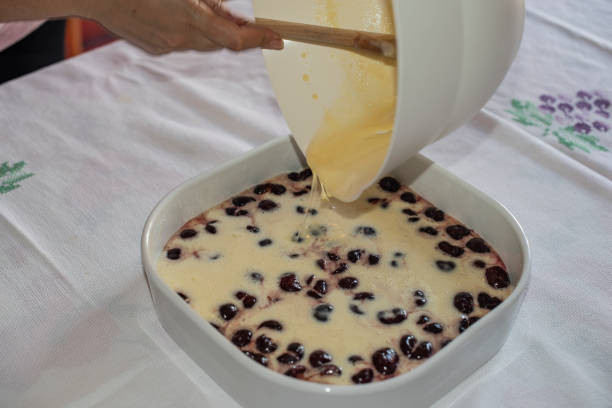 istock Clafoutis with Cherry. Red and ripe cherries. Preparation and close-up. 1040526414