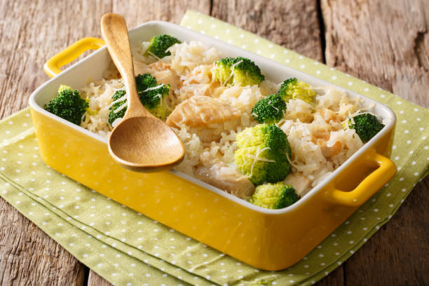 istock Healthy lunch: rice with broccoli, chicken, garlic and cheese close-up. horizontal 1040535286