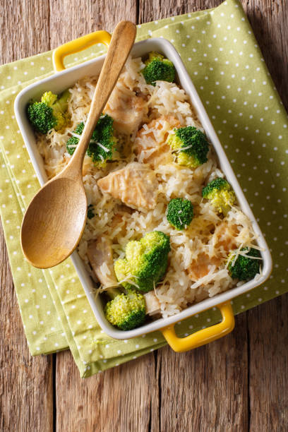 istock Delicious rice with broccoli, chicken and cheese close-up in a baking dish. Vertical top view 1040538060