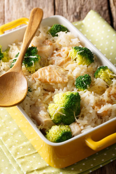 istock Dietary foods: rice baked with broccoli, chicken and cheese close-up. vertical 1040539310